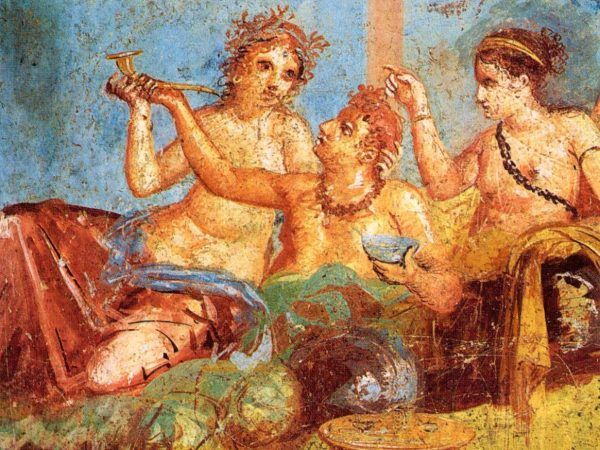 Nie ma dobrej uczty bez skąpanych w perfumach gołębi... Rzymski bankiet na fresku z Pompejów (domena publiczna).