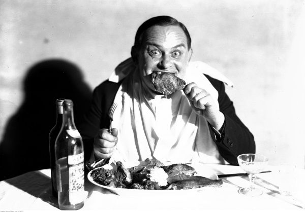 Aktor Józef Leliwa na przerysowanym portrecie ukazującym go w trakcie spożywania posiłku.