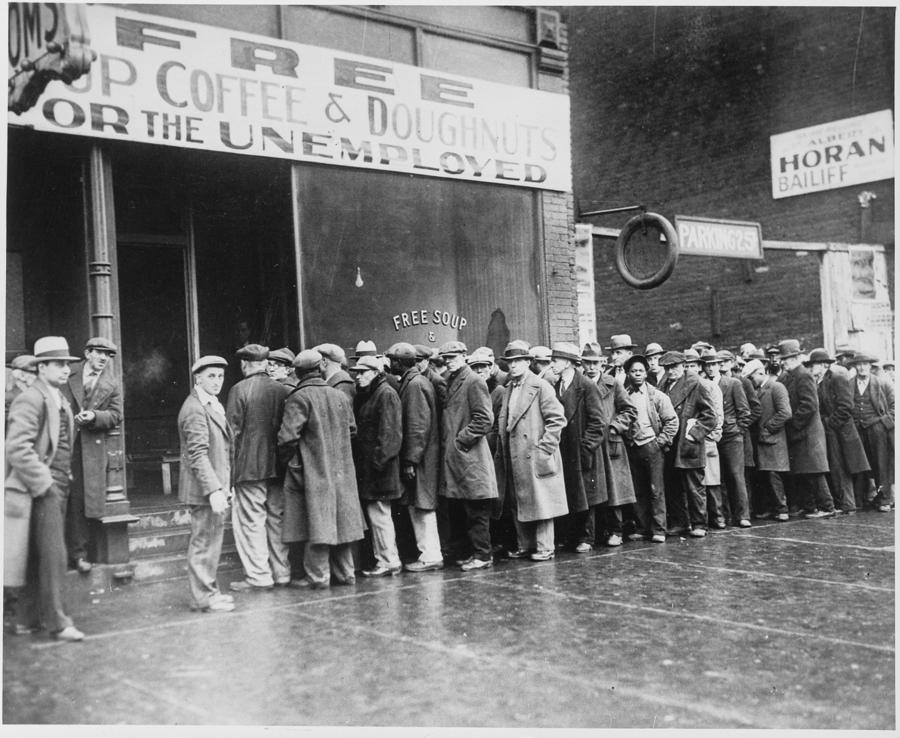 UFO 25.04.2024 r. Unemployed_men_queued_outside_a_depression_soup_kitchen_opened_in_Chicago_by_Al_Capone_02-1931_-_NARA_-_541927